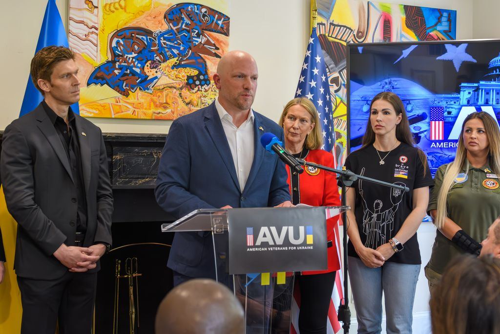 The American Veterans for Ukraine founding group at the launch podium in Ukraine House