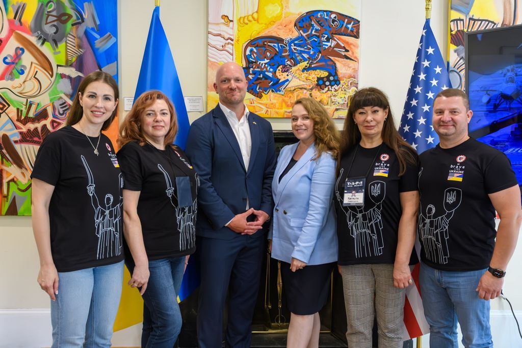 Group portrait of the American Veterans for Ukraine team at the launch