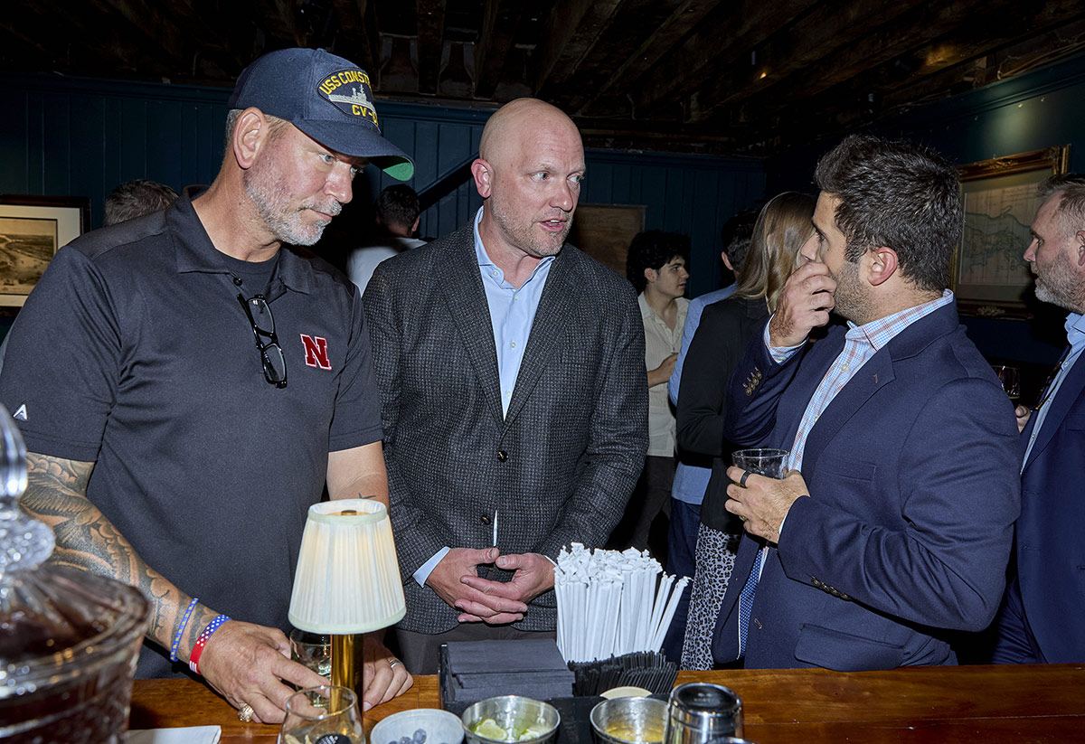 Conversation at the bar during the IVA launch reception