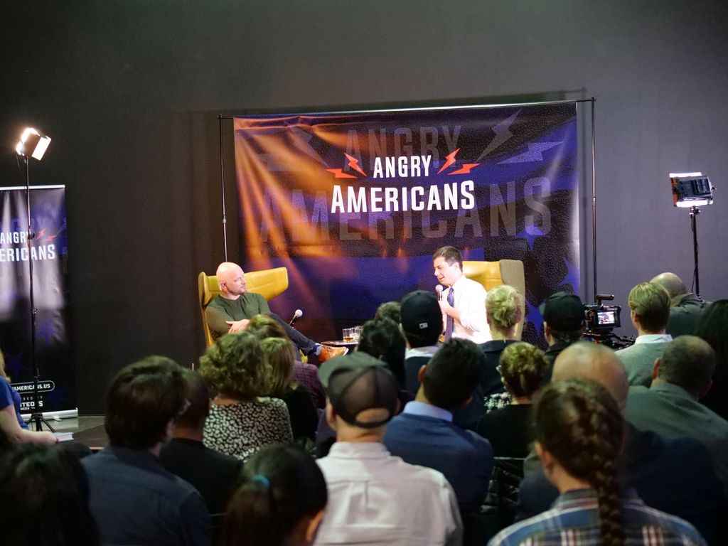 A full room at the Classic Car Club for Pete Buttigieg